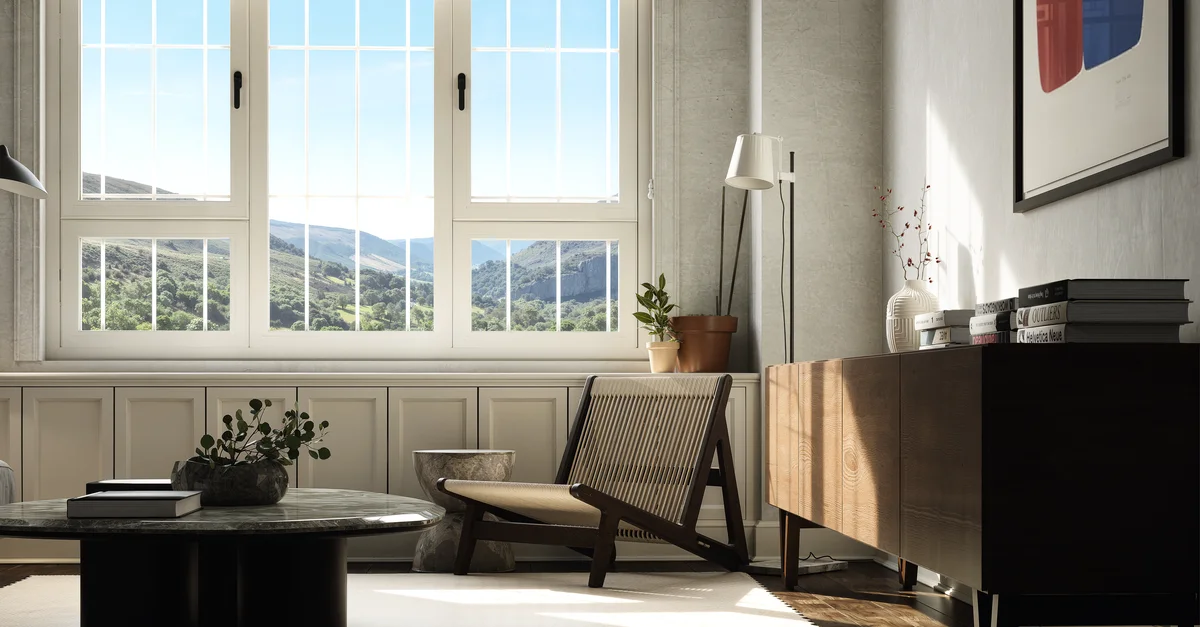 Luminoso interior de sala de estar con vista a la montaña a través de grandes ventanales, con muebles contemporáneos.